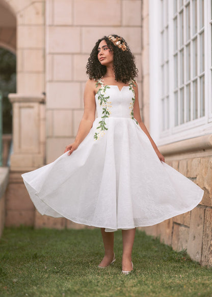 chic size inclusive model wearing JessaKae Lily Petal Dress