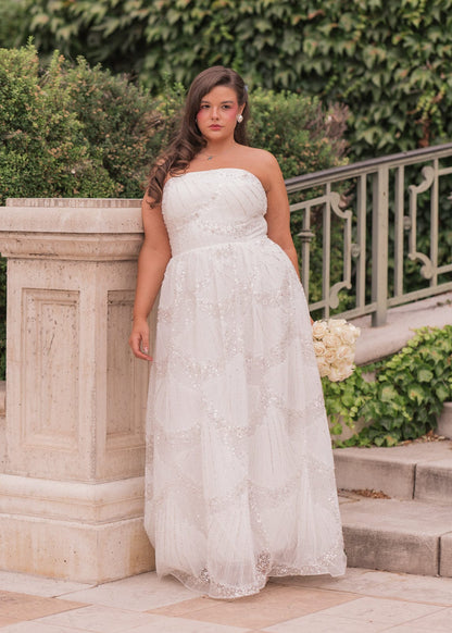 chic size inclusive model wearing JessaKae Pearl Dress